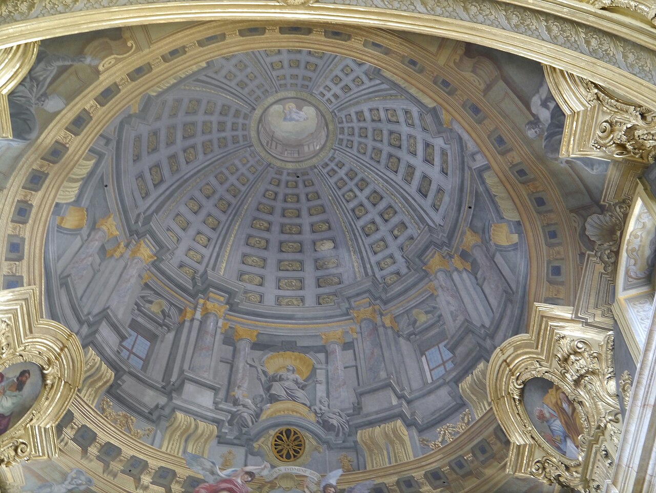 The richly decorated ceiling of Vienna’s Jesuit Church, showing Andrea Pozzo’s painted false cupola.