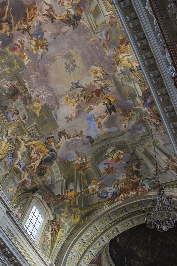 Glory of Saint Ignatius — Illusionistic Ceiling — Painted architecture extends a church ceiling toward an open heaven.
